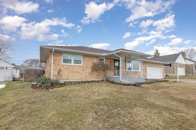 ranch-style home with an attached garage, brick siding, and a front yard