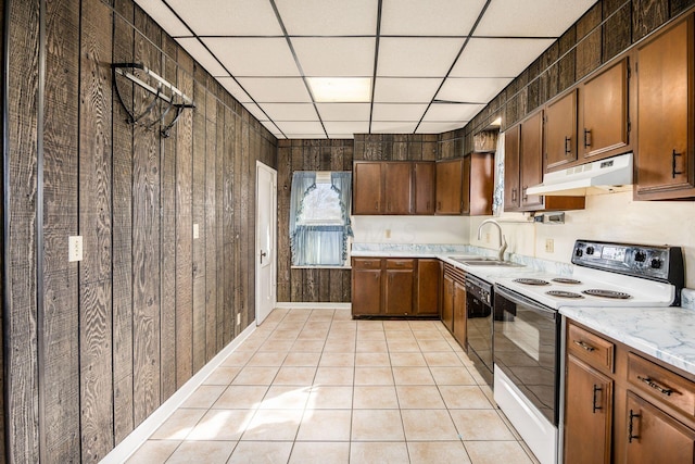 kitchen featuring light tile patterned floors, black dishwasher, electric range, under cabinet range hood, and a sink