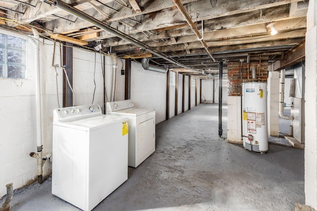 unfinished basement with water heater and washer and clothes dryer