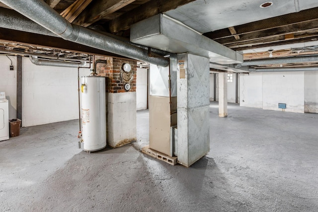 unfinished basement with heating unit, washer / dryer, and water heater