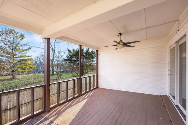 wooden deck with a ceiling fan