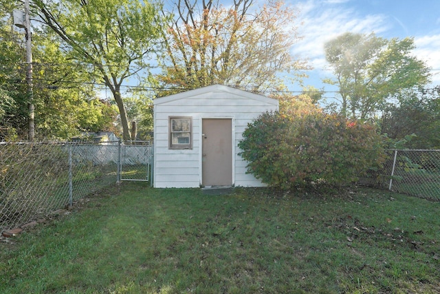 view of shed with a fenced backyard