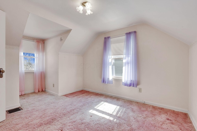 bonus room featuring visible vents, baseboards, carpet flooring, and vaulted ceiling