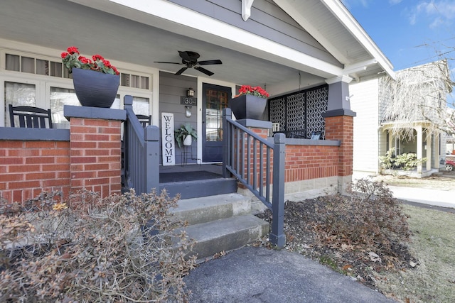 property entrance with covered porch, a ceiling fan, and brick siding