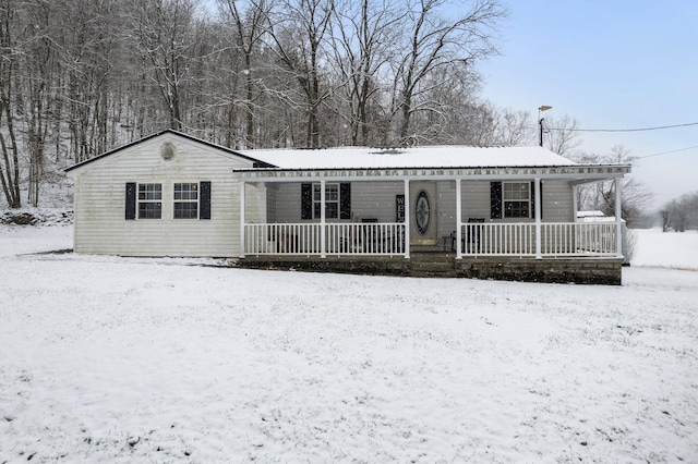 single story home featuring covered porch