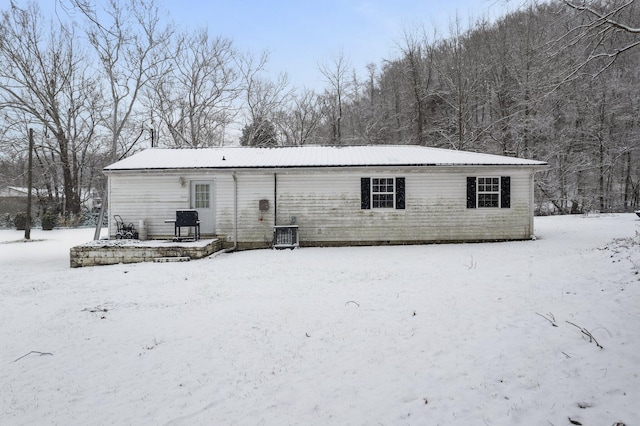 view of snow covered house