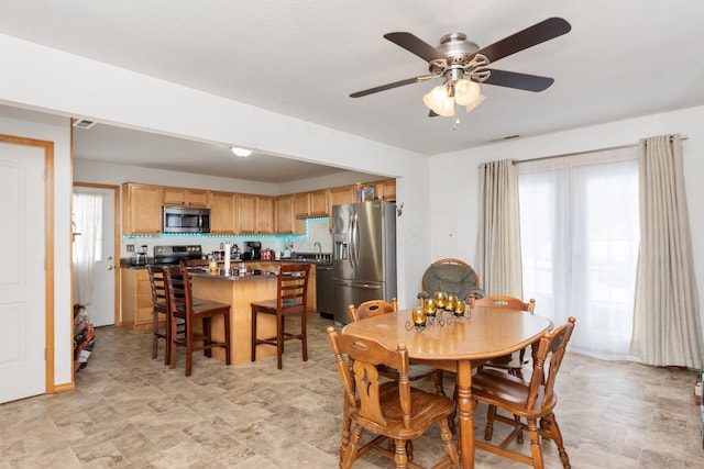 dining area with ceiling fan