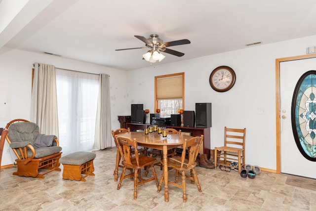 dining space featuring ceiling fan