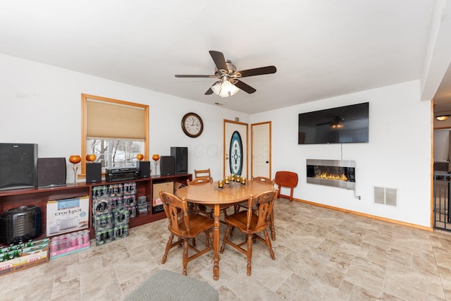 dining space with ceiling fan