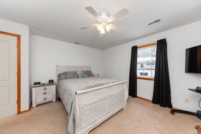 bedroom with light carpet and ceiling fan