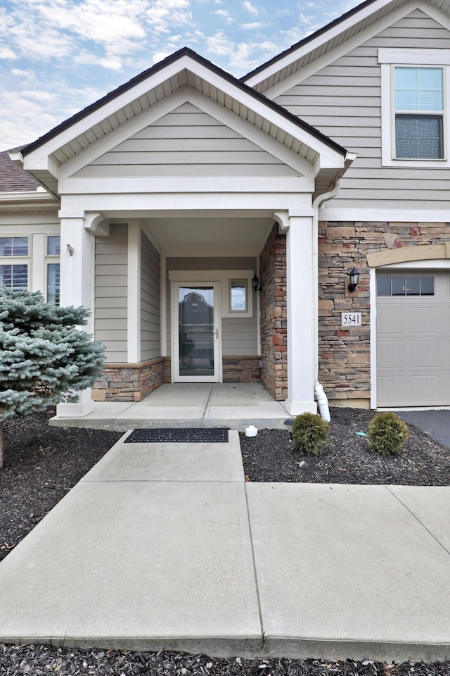 view of exterior entry with a porch