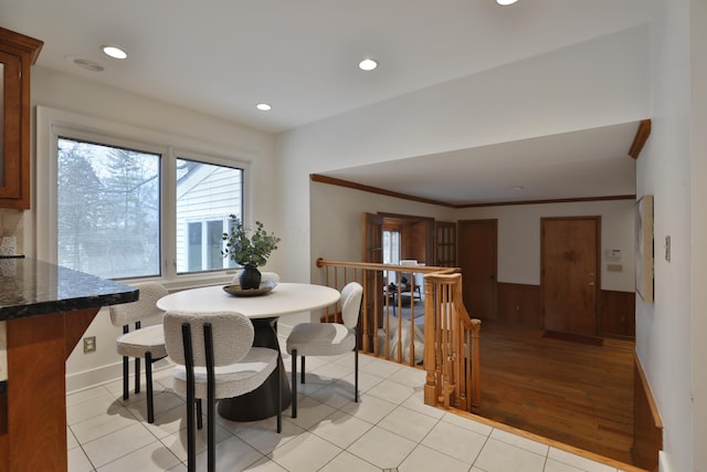 dining space featuring ornamental molding, light tile patterned flooring, recessed lighting, and baseboards