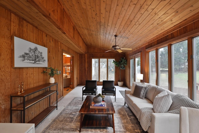 sunroom featuring lofted ceiling, wood ceiling, and ceiling fan