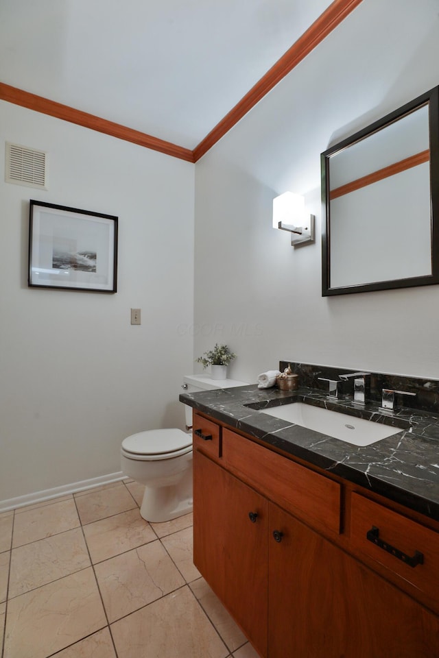 half bathroom with ornamental molding, visible vents, vanity, and toilet