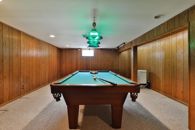 game room featuring carpet floors and wood walls