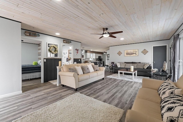 living area featuring a ceiling fan, recessed lighting, wood ceiling, and wood finished floors