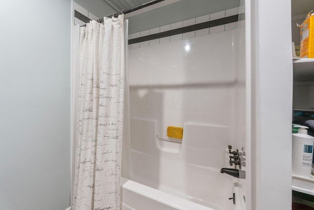 bathroom featuring shower / bath combo with shower curtain