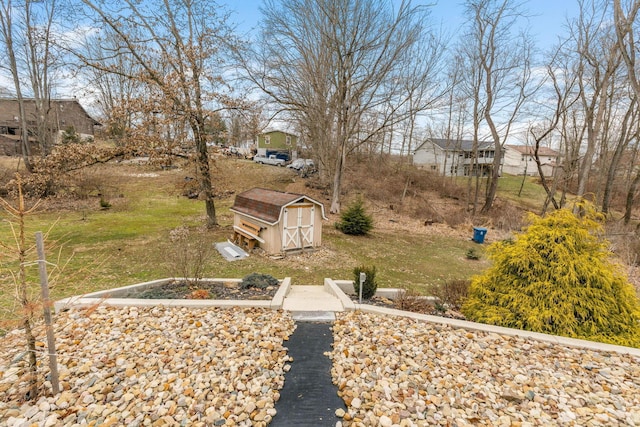 view of yard featuring an outbuilding and a shed