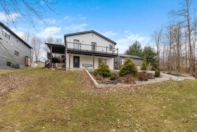 back of house with a deck, central AC, a lawn, and stairs