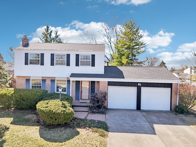 view of front of home with brick siding, roof with shingles, a chimney, driveway, and an attached garage