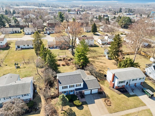 birds eye view of property with a residential view