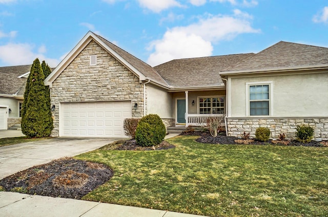 view of front of home featuring a garage, a front lawn, and covered porch