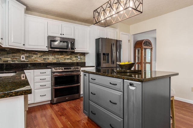 kitchen with stainless steel appliances, dark wood-style flooring, gray cabinets, and white cabinets