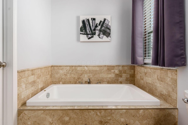 full bathroom featuring a garden tub