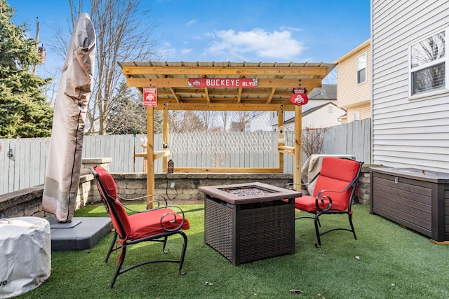 view of patio / terrace featuring a fire pit and fence