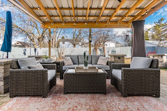 view of patio featuring an outdoor hangout area and a fenced backyard