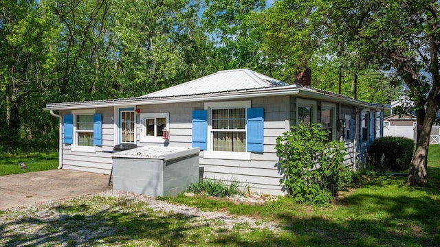 109 Beacon Light Ln, Buckeye Lake, OH 43008 - view of front of property with a chimney, metal roof, and a front yard