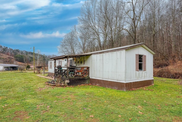 view of outbuilding featuring a yard