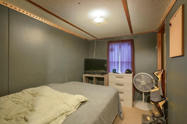 bedroom with light carpet and a textured ceiling