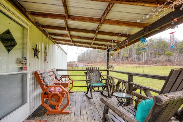 wooden deck featuring a yard