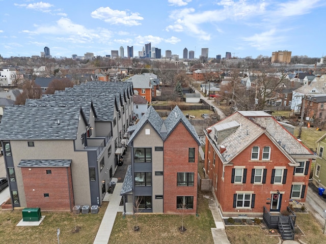 birds eye view of property with a view of city