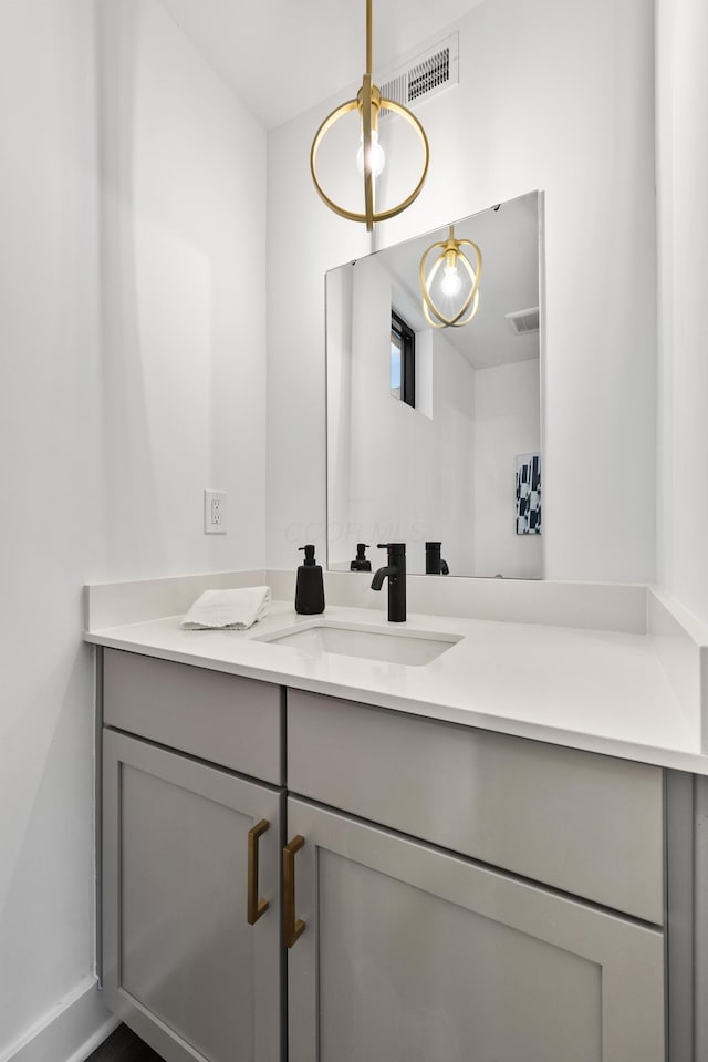 bathroom with visible vents and vanity