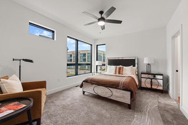 bedroom with carpet floors, ceiling fan, and baseboards