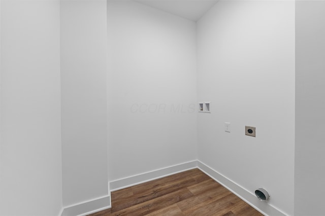 laundry area featuring laundry area, baseboards, dark wood-style floors, hookup for a washing machine, and electric dryer hookup