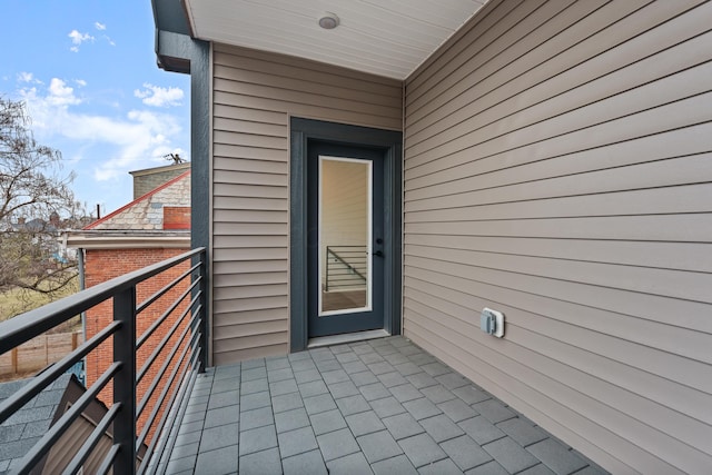 entrance to property with a balcony