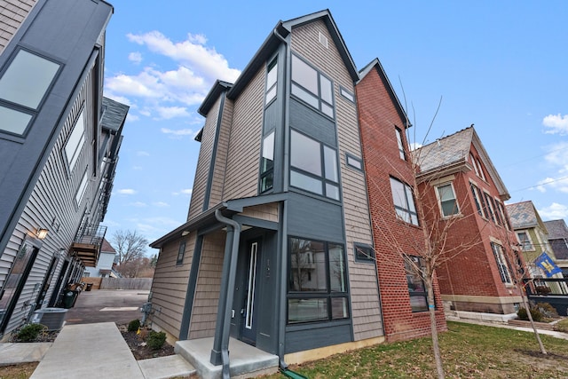 view of side of property featuring central air condition unit