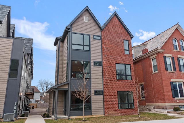 view of building exterior featuring central AC unit