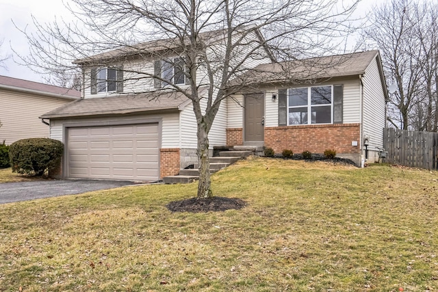 split level home featuring a garage and a front lawn