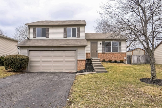 split level home featuring a garage and a front yard