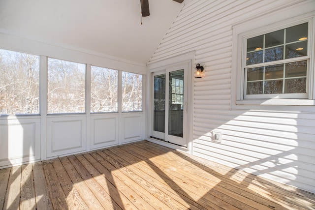 unfurnished sunroom with ceiling fan and lofted ceiling