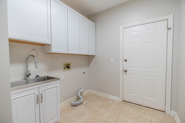 washroom with hookup for a washing machine, light tile patterned flooring, hookup for an electric dryer, sink, and cabinets