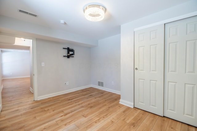 interior space with light hardwood / wood-style flooring and a closet