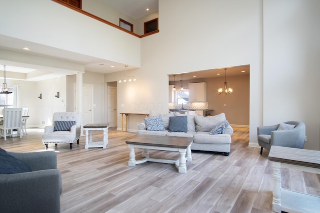 6268 Bellow Valley Dr, Dublin, OH 43016 - living area with light wood finished floors, plenty of natural light, and an inviting chandelier
