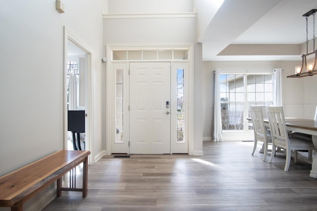6268 Bellow Valley Dr, Dublin, OH 43016 - entryway with an inviting chandelier, wood finished floors, and baseboards