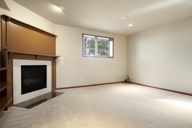 6268 Bellow Valley Dr, Dublin, OH 43016 - unfurnished living room with recessed lighting, carpet flooring, a fireplace, and baseboards