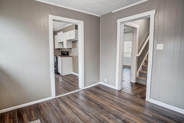 interior space with crown molding and dark hardwood / wood-style floors